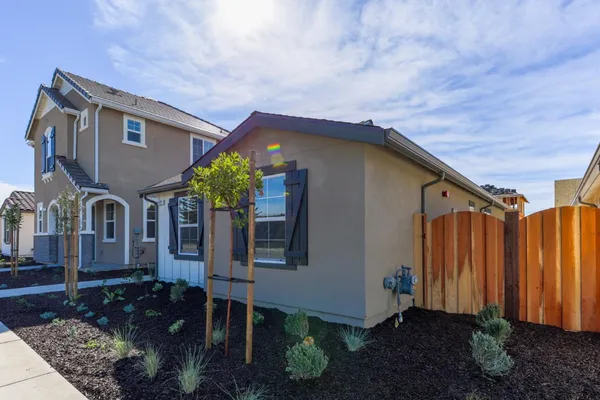 a house view with a backyard space