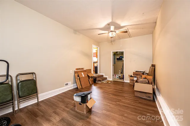 a view of a workspace with furniture and lounge chair