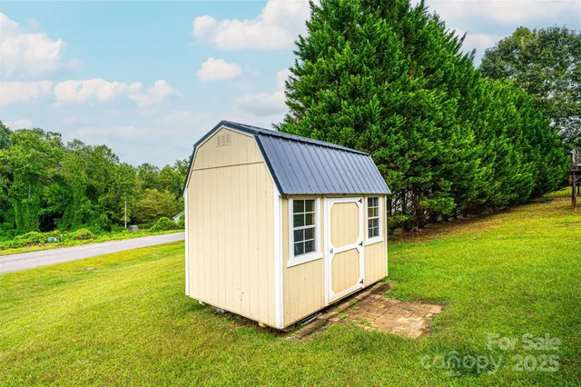 a view of backyard with trampoline