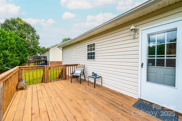 a view of a house with swimming pool and sitting area