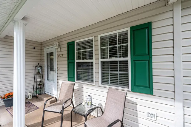 a view of a chair and table in the balcony
