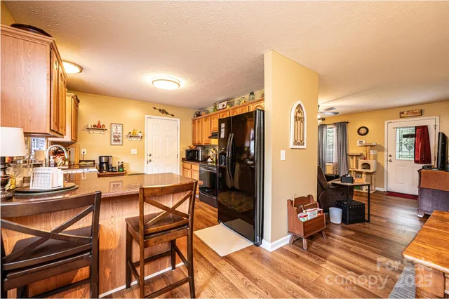 a view of a kitchen and dining room