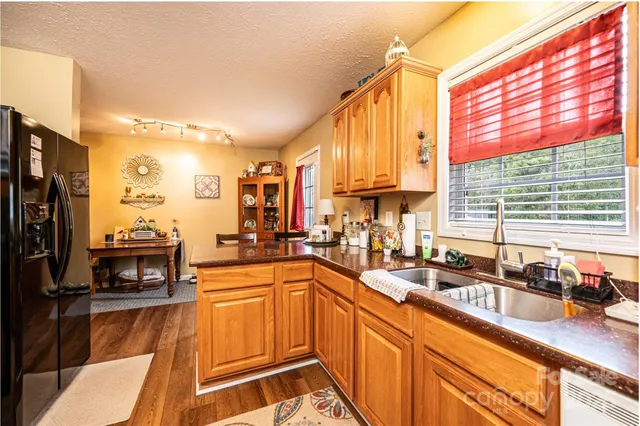 a kitchen with lots of counter top space and a window