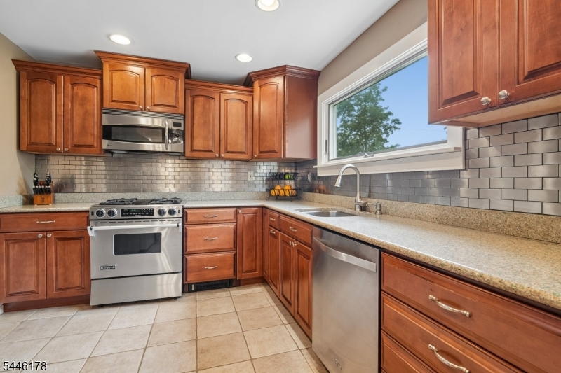 361 North Road Chester, NJ 07930 - Photo 8 of 17 a kitchen with stainless steel appliances granite countertop a sink and cabinets