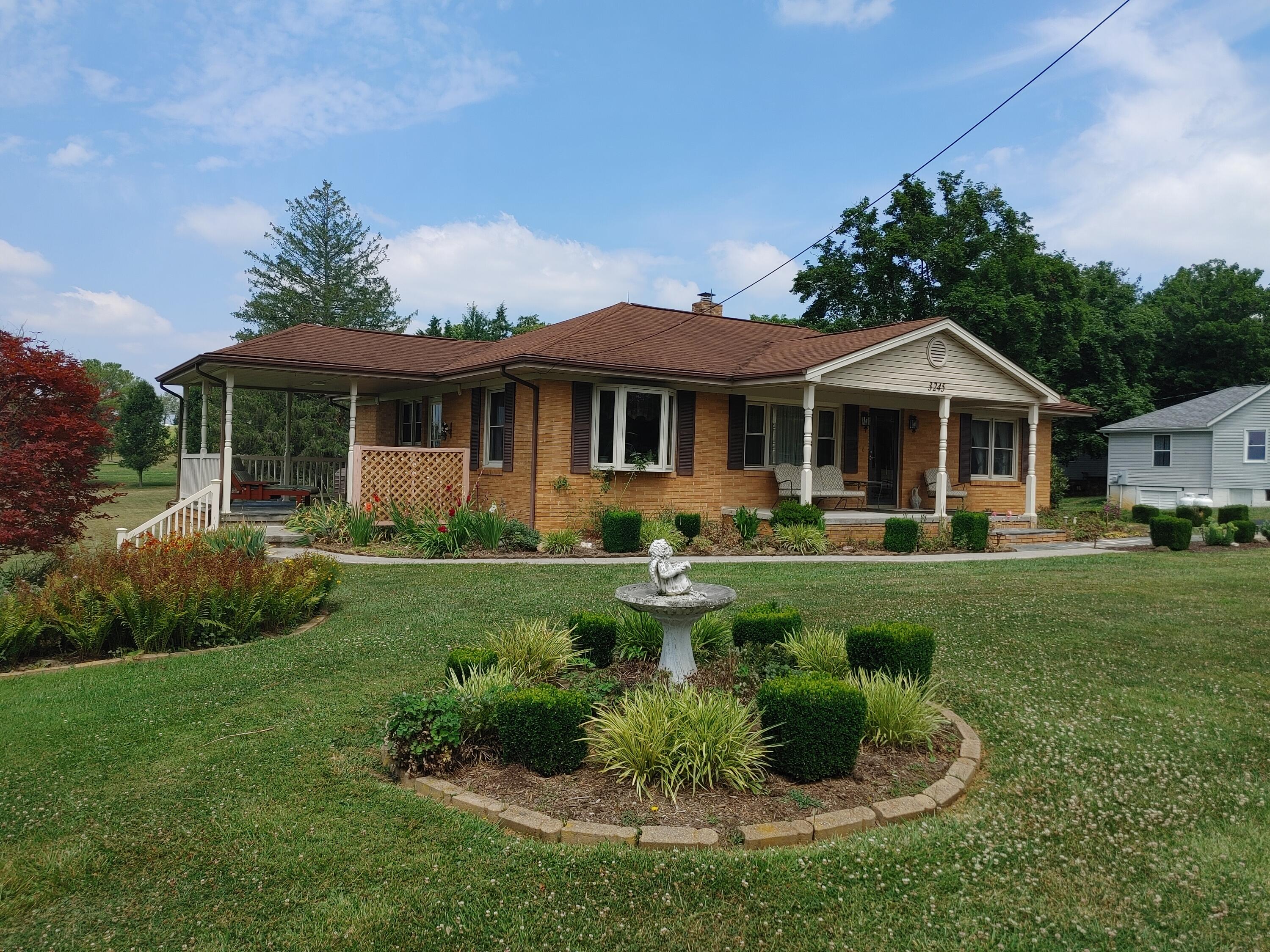 3245 Riner Road Christiansburg, VA 24073 - Photo 1 of 31 a front view of a house with a yard