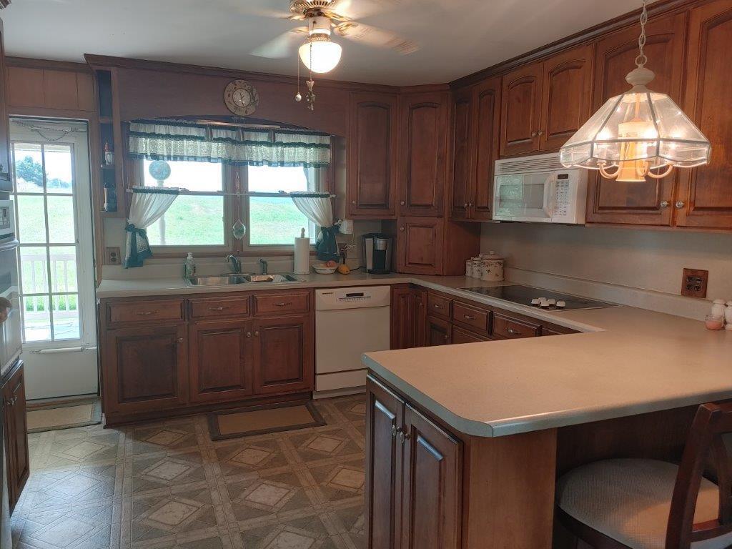 3245 Riner Road Christiansburg, VA 24073 - Photo 13 of 31 a kitchen that has a sink and a stove in it