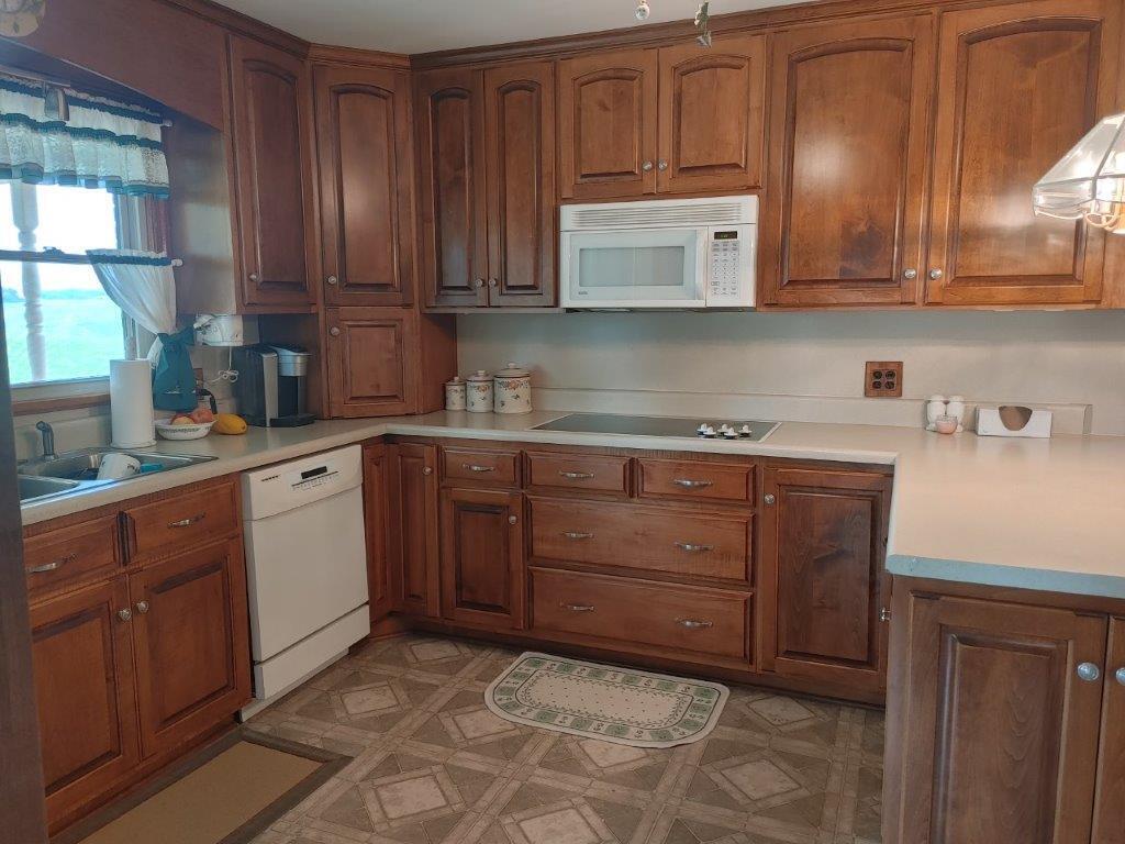 3245 Riner Road Christiansburg, VA 24073 - Photo 14 of 31 a kitchen with stainless steel appliances granite countertop a sink a stove and cabinets