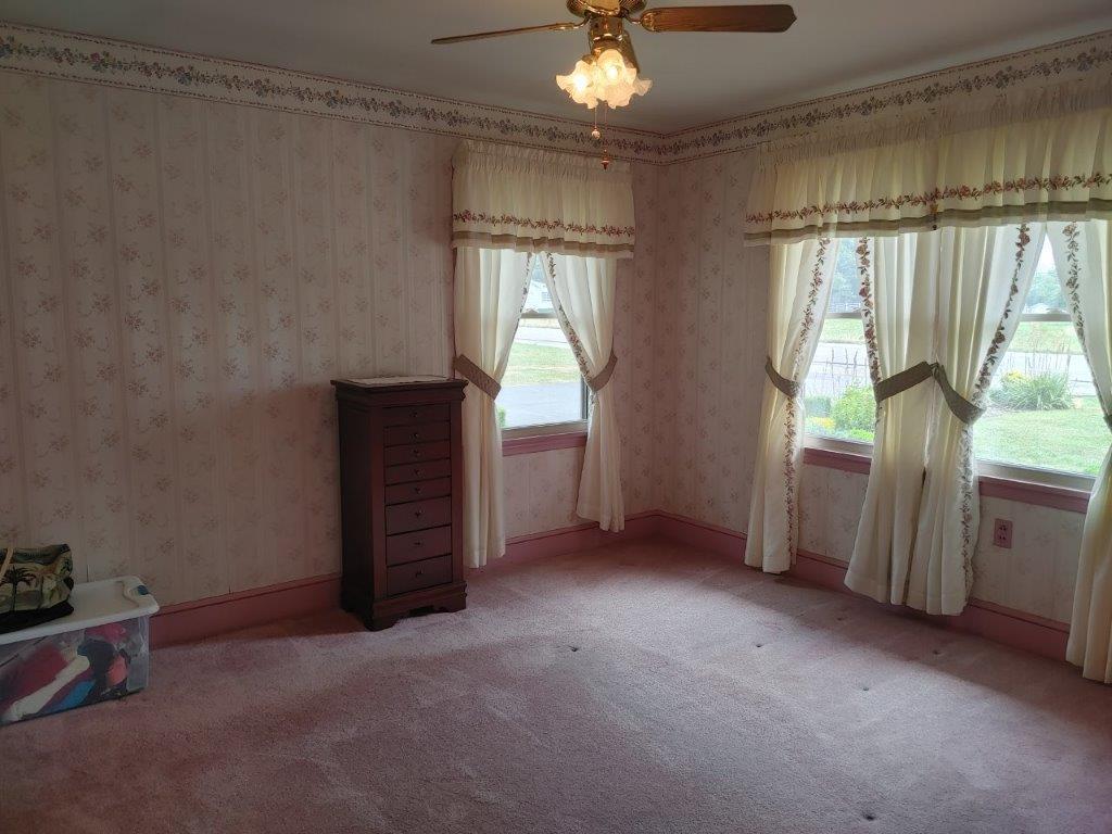 3245 Riner Road Christiansburg, VA 24073 - Photo 18 of 31 en empty room with windows and chandelier
