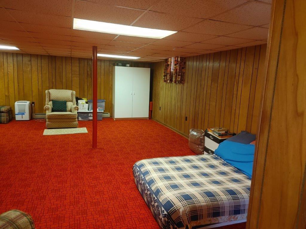 3245 Riner Road Christiansburg, VA 24073 - Photo 21 of 31 a bedroom with a bed and furniture