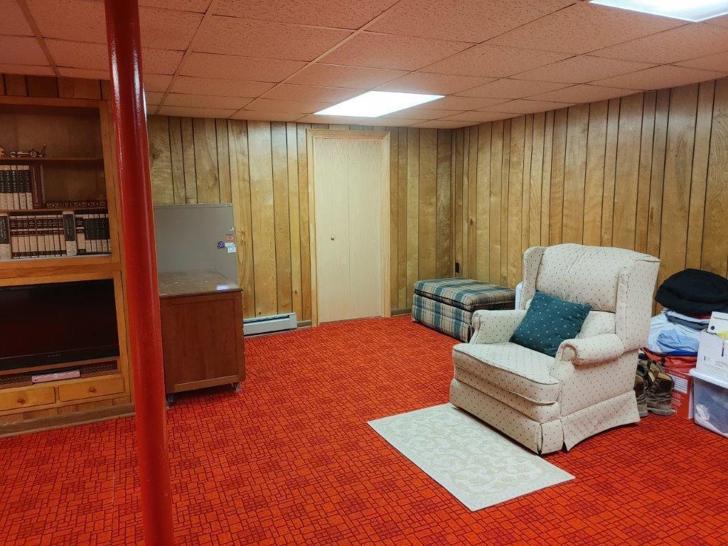 3245 Riner Road Christiansburg, VA 24073 - Photo 23 of 31 a living room with furniture and a flat screen tv