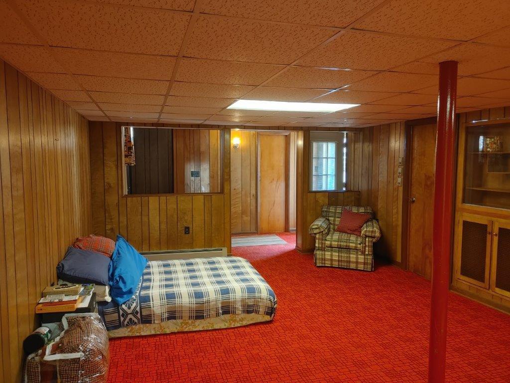 3245 Riner Road Christiansburg, VA 24073 - Photo 24 of 31 a bedroom with a bed and wooden floor