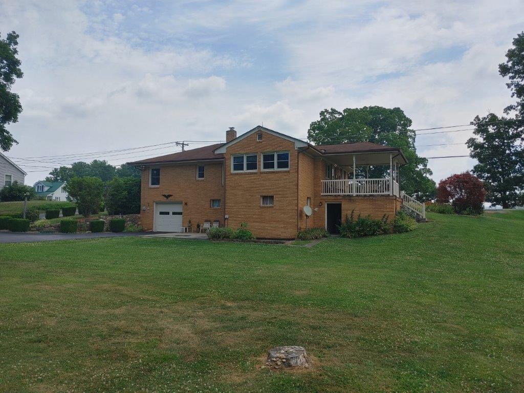 3245 Riner Road Christiansburg, VA 24073 - Photo 10 of 31 a front view of a house with garden
