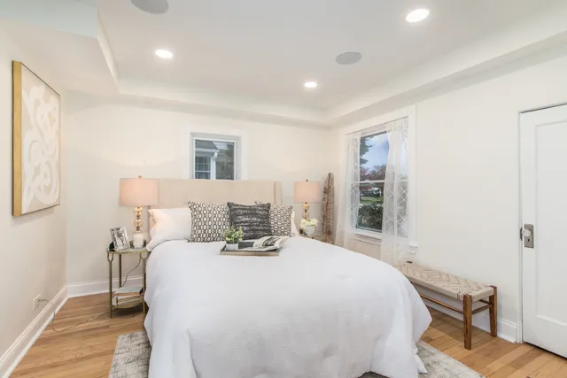 a bedroom with a bed and a table