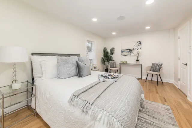 a large white bed in a white room