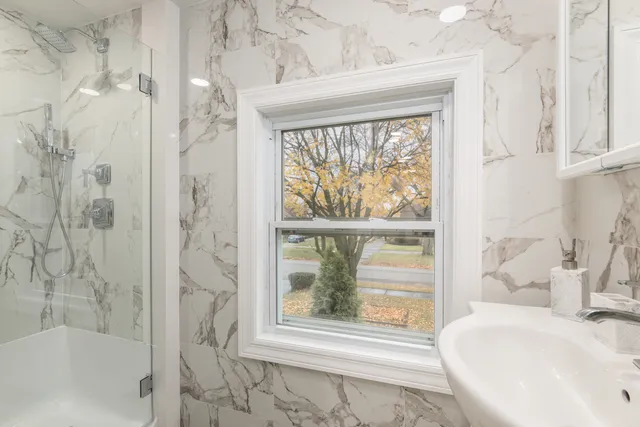 a bathroom with a bathtub and shower