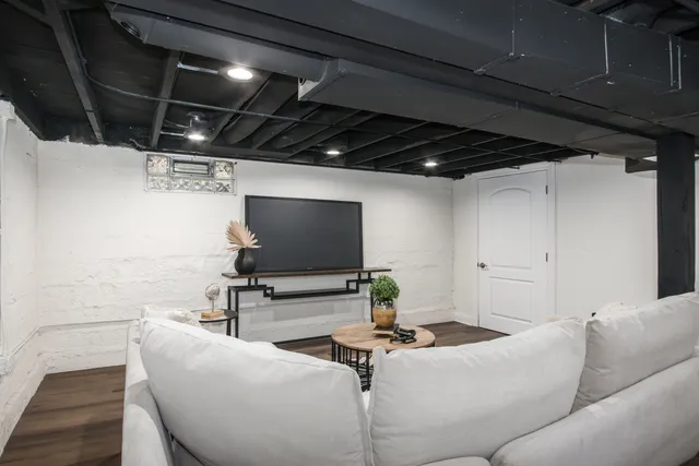 a living room with furniture and a flat screen tv