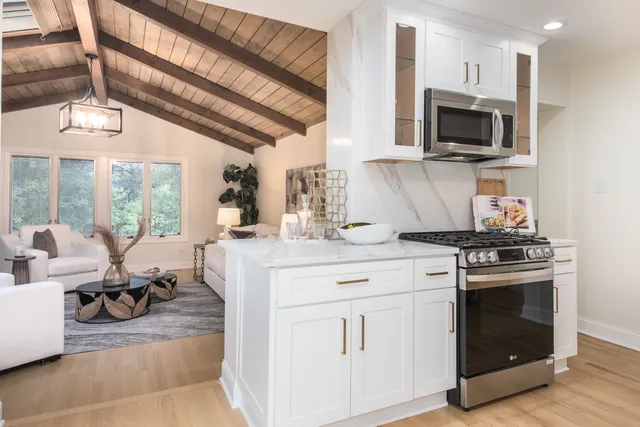 a kitchen with a stove and a microwave oven