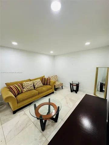 a living room with furniture and a couch