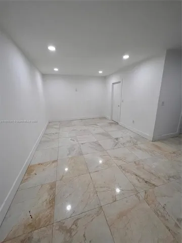 an empty room with natural light