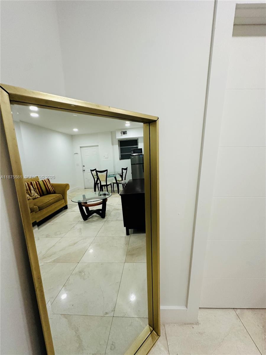 1723 Jackson Street, Unit 2 Hollywood, FL 33020 - Photo 8 of 8 a room with gym equipment and a shower