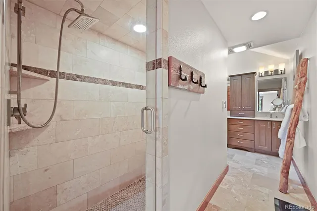 a bathroom with a shower and a sink