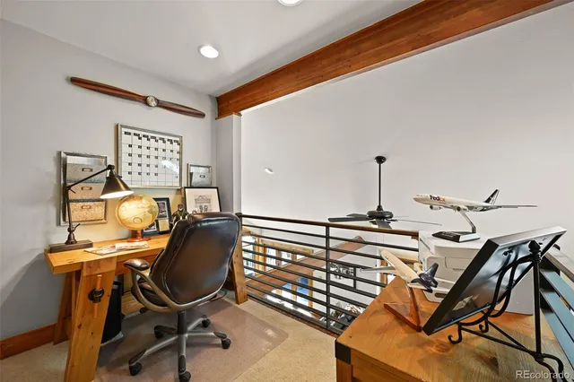 a view of a workspace with furniture