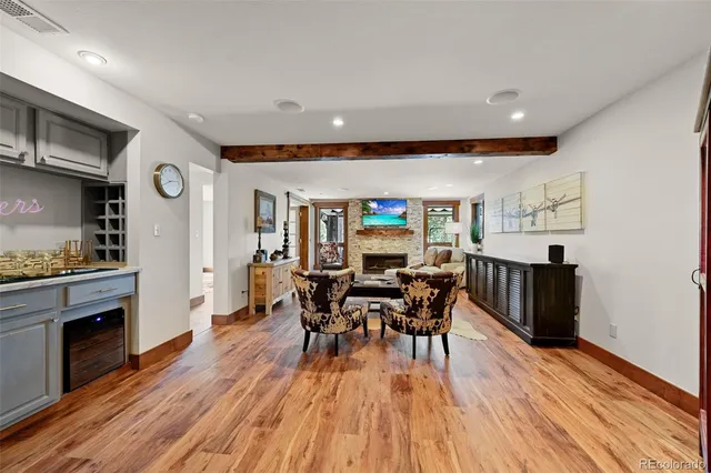 a view of a dining room with furniture and wooden floor