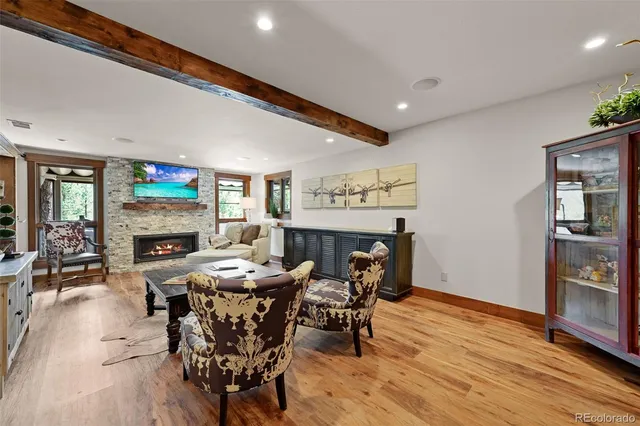 a view of a dining room with furniture and wooden floor