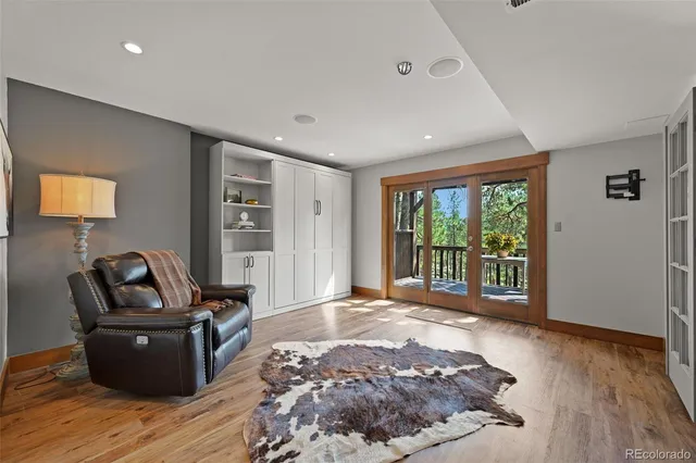 a bed room with a bed and wooden floor