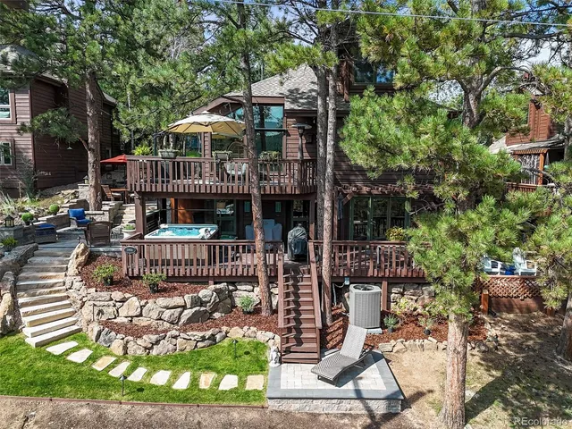 an aerial view of a house with a yard