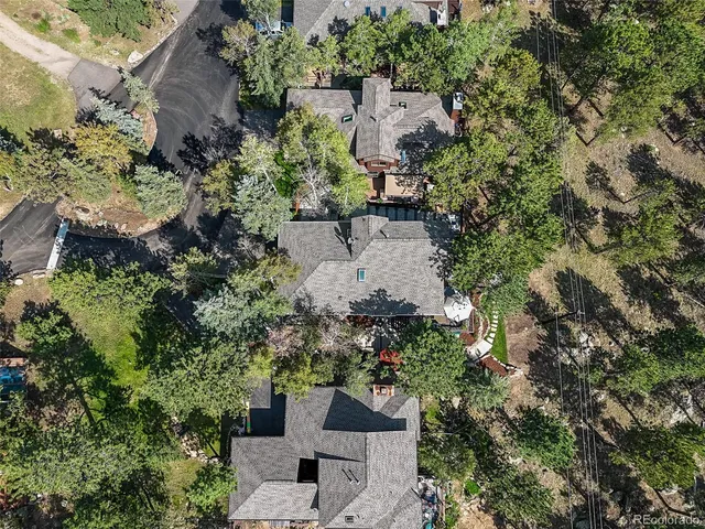 a view of a lush green hillside and a houses