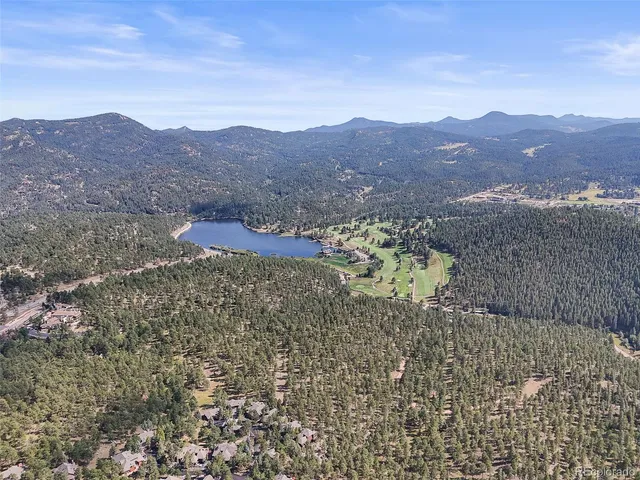 a view of a city with mountains in the background