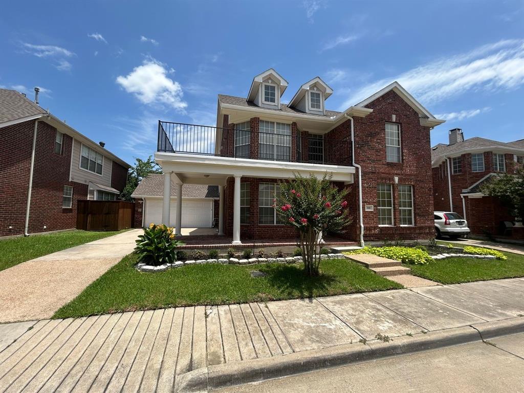 588 Southridge Way Irving, TX 75063 - Photo 2 of 26 a view of a brick house with a yard in front of it