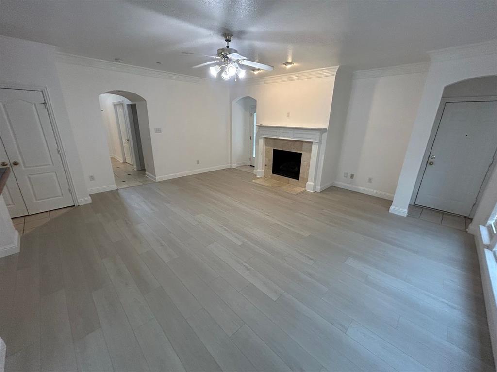 588 Southridge Way Irving, TX 75063 - Photo 9 of 26 a view of empty room with fireplace and wooden floor