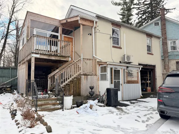 a view of a house with snow on the wall