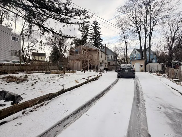 a view of the snow on the road