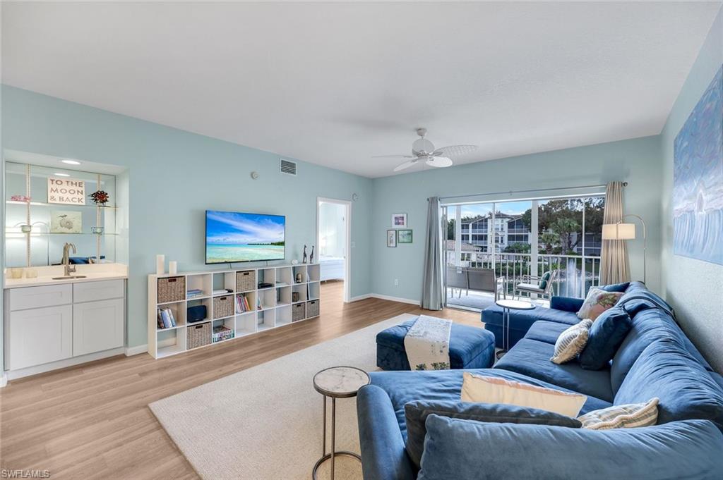 6030 Chardonnay Lane, Unit 203 Naples, FL 34119 - Photo 8 of 28 a living room with furniture and view of kitchen