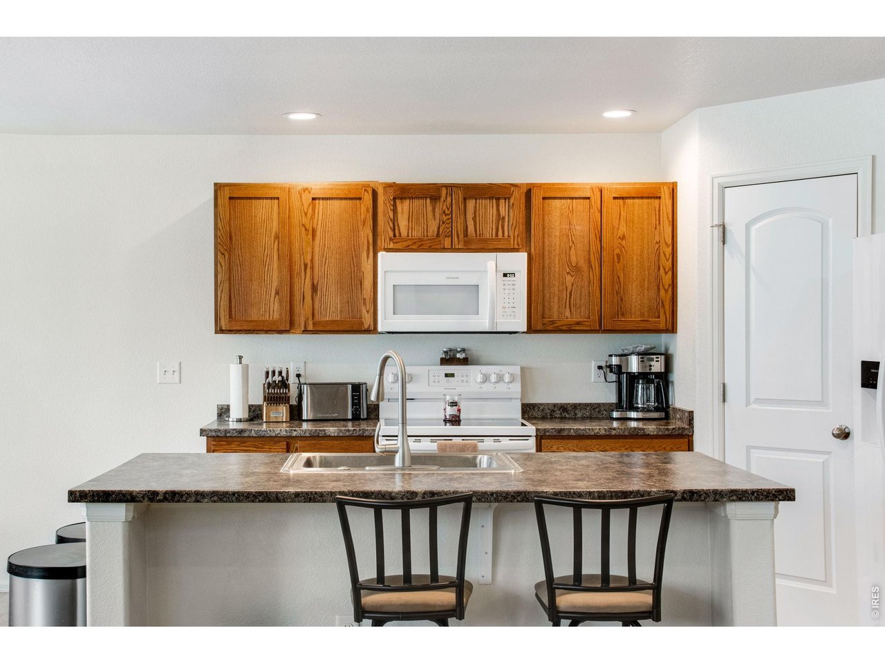2671 Doe Rdg Way Johnstown, CO 80534 - Photo 15 of 37 Large center island