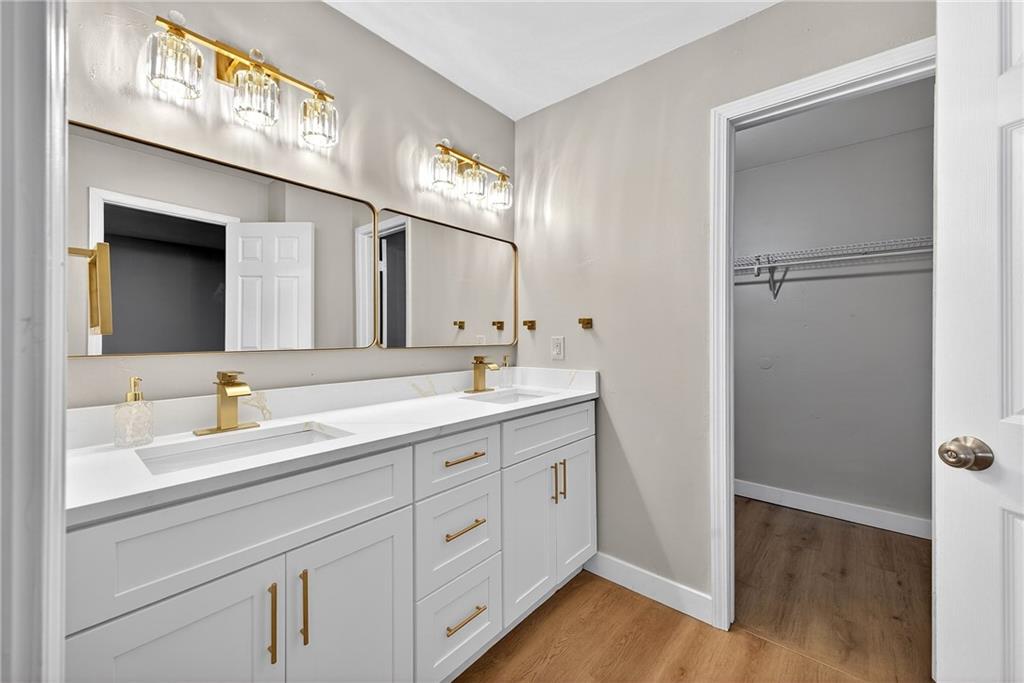 2874 Fairburn Road Southwest Atlanta, GA 30331 - Photo 14 of 34 a spacious bathroom with a double vanity sink and mirror
