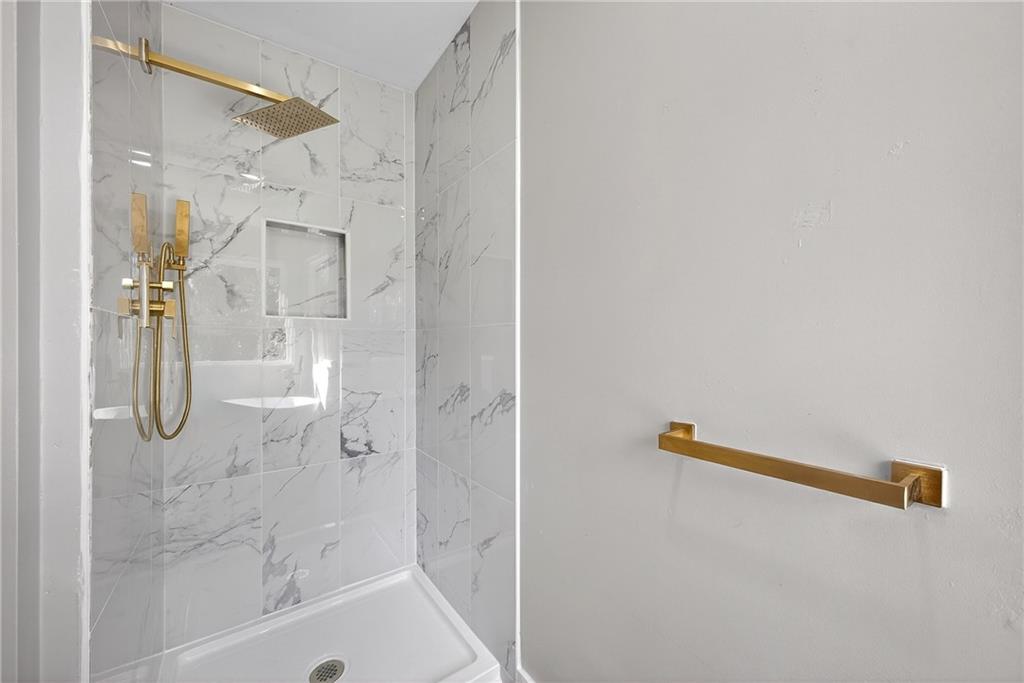 2874 Fairburn Road Southwest Atlanta, GA 30331 - Photo 15 of 34 a bathroom with a shower