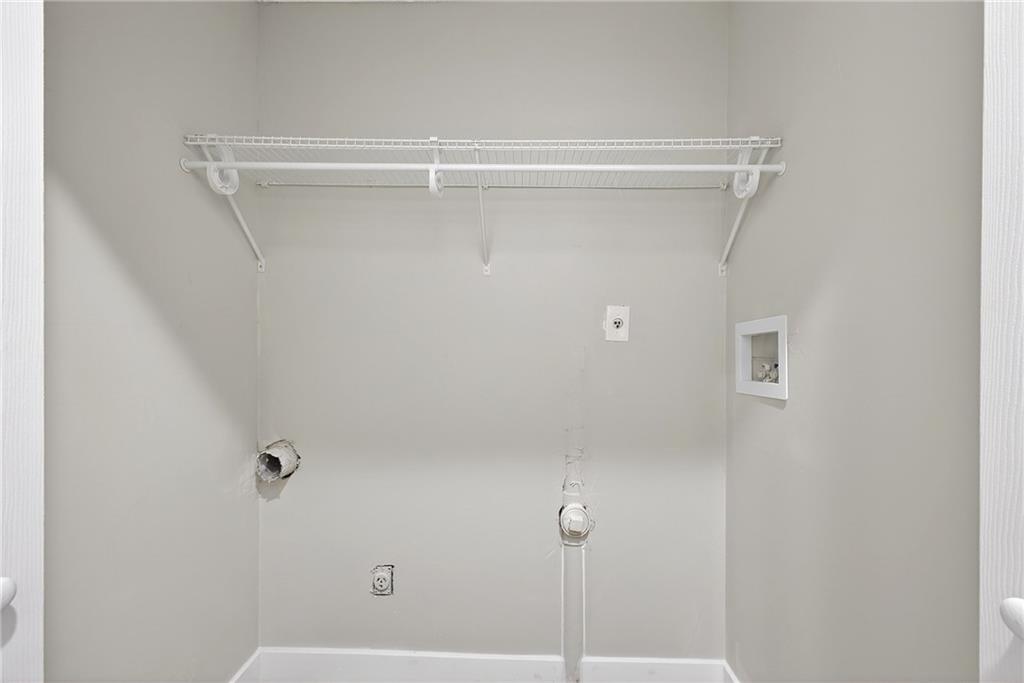 2874 Fairburn Road Southwest Atlanta, GA 30331 - Photo 21 of 34 a bathroom with a glass shower door