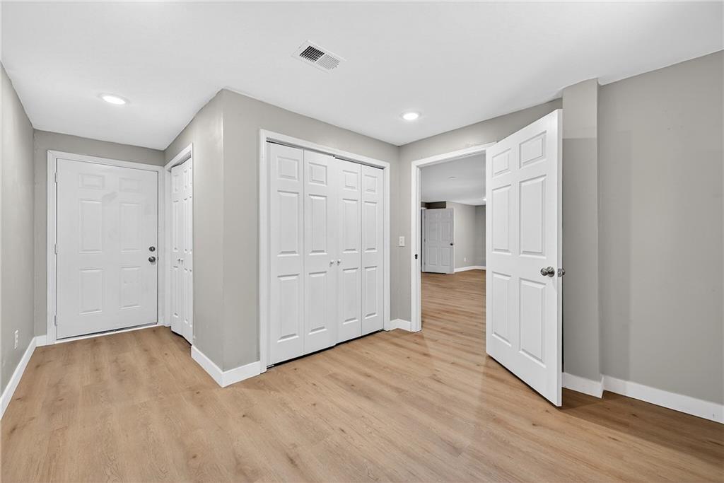 2874 Fairburn Road Southwest Atlanta, GA 30331 - Photo 26 of 34 an empty room with wooden floor