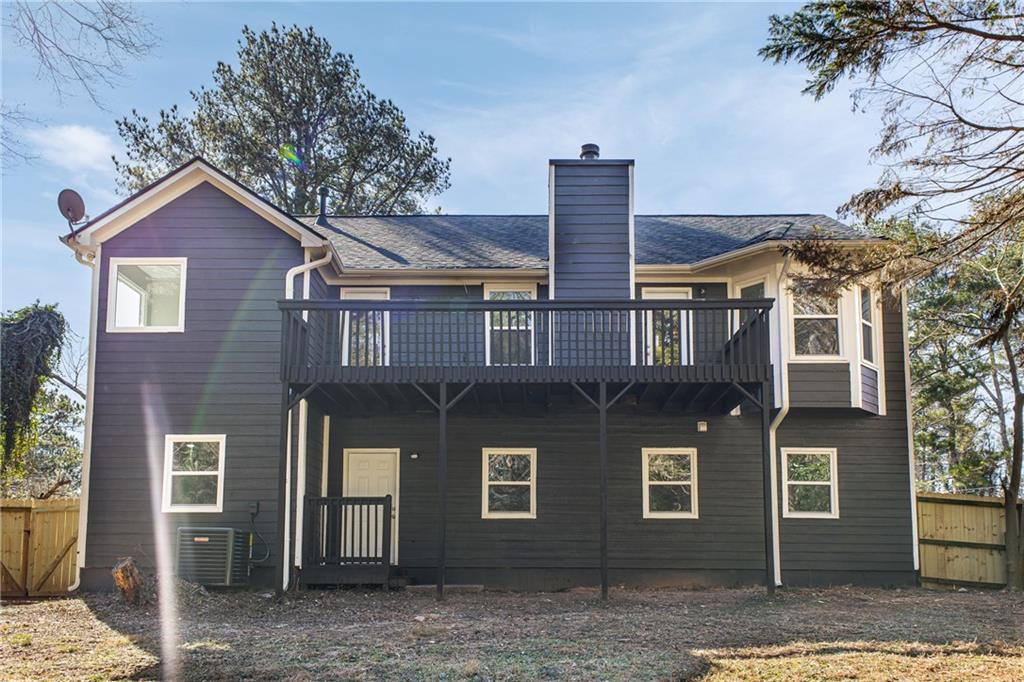 2874 Fairburn Road Southwest Atlanta, GA 30331 - Photo 27 of 34 a front view of a house with a yard
