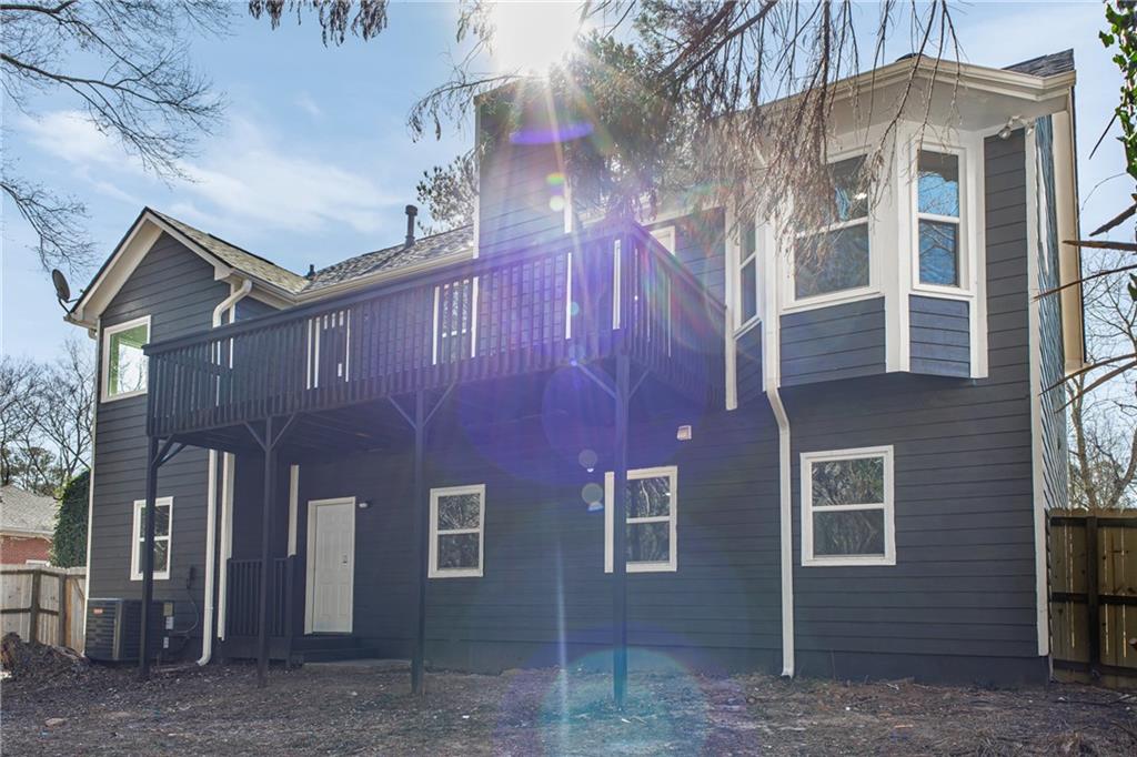 2874 Fairburn Road Southwest Atlanta, GA 30331 - Photo 28 of 34 a front view of a building with a yard