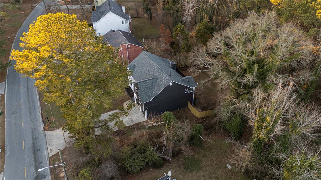 2874 Fairburn Road Southwest Atlanta, GA 30331 - Photo 30 of 34 an aerial view of a house with a yard and garden