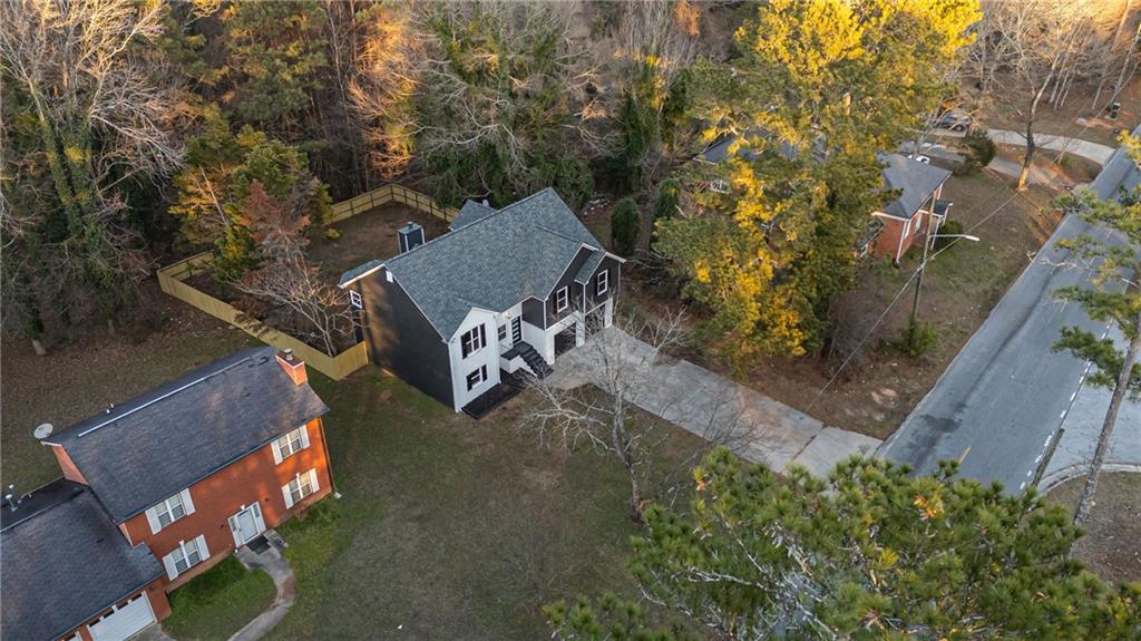 2874 Fairburn Road Southwest Atlanta, GA 30331 - Photo 31 of 34 an aerial view of a house with garden space and street view