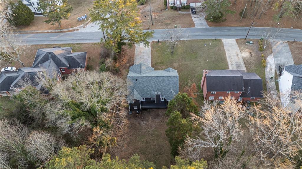 2874 Fairburn Road Southwest Atlanta, GA 30331 - Photo 33 of 34 an aerial view of a house with a yard and large tree