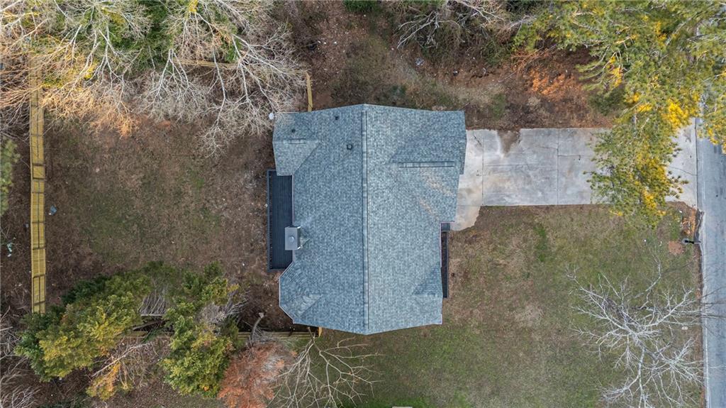 2874 Fairburn Road Southwest Atlanta, GA 30331 - Photo 34 of 34 an aerial view of a houses with trees