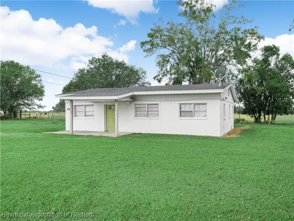 a view of a house with a back yard