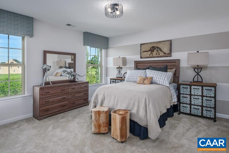 1617 Fowler Ridge Court Charlottesville, VA 22901 - Photo 17 of 23 a bed room with a bed and a window
